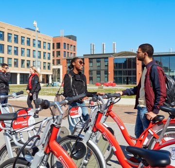 Students using Santander bikes on Bay Campus