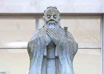 The statue of Confucious looking over the Vivian Tower Pool - Singleton Park Campus