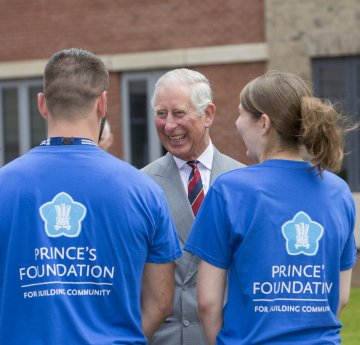HRH meeting students in Prince's Foundation t-shirts