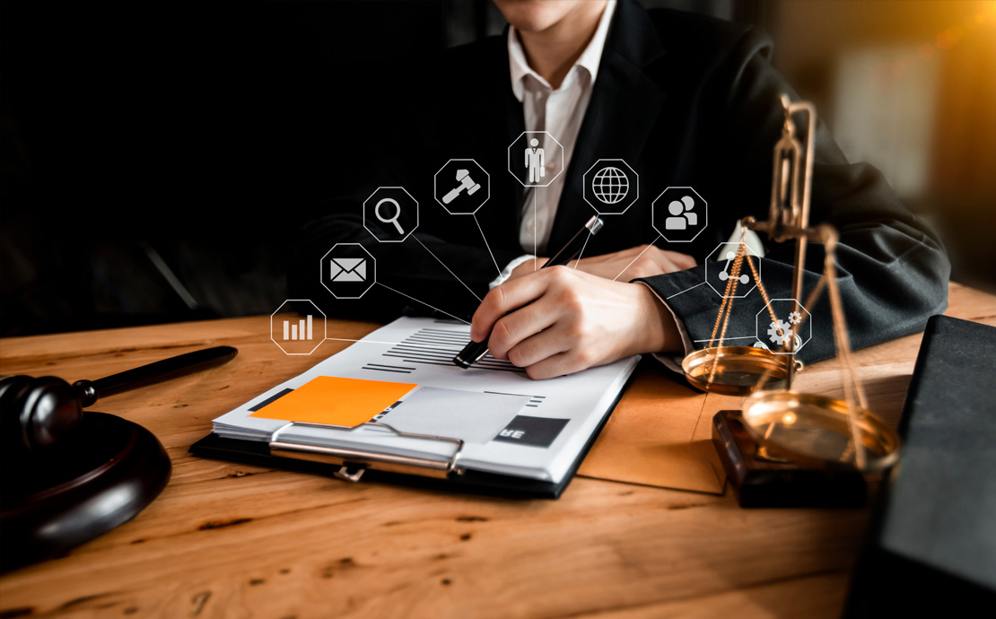 A person writing with digital icons coming off the page