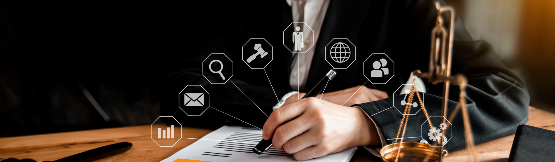 A person writing with digital icons surrounding the page