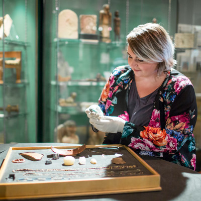 woman holding artifacts