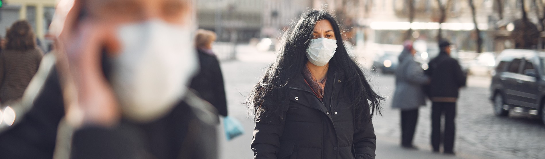 People walking in street with face mask on