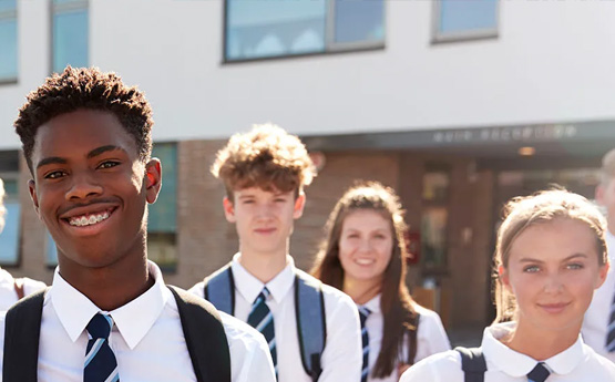4 secondary-age children smiling 