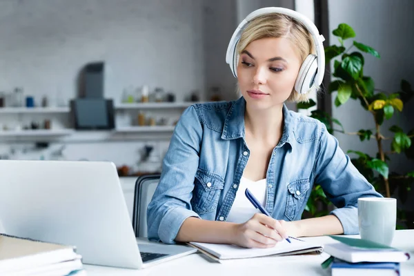 A female student studying online