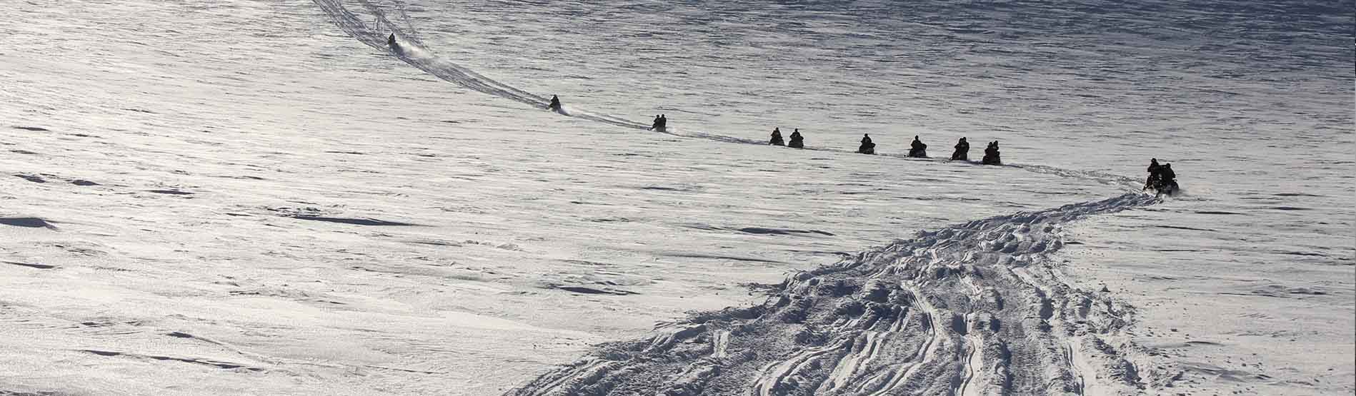 Snowmobile travel in the icy landscape of Svalbard