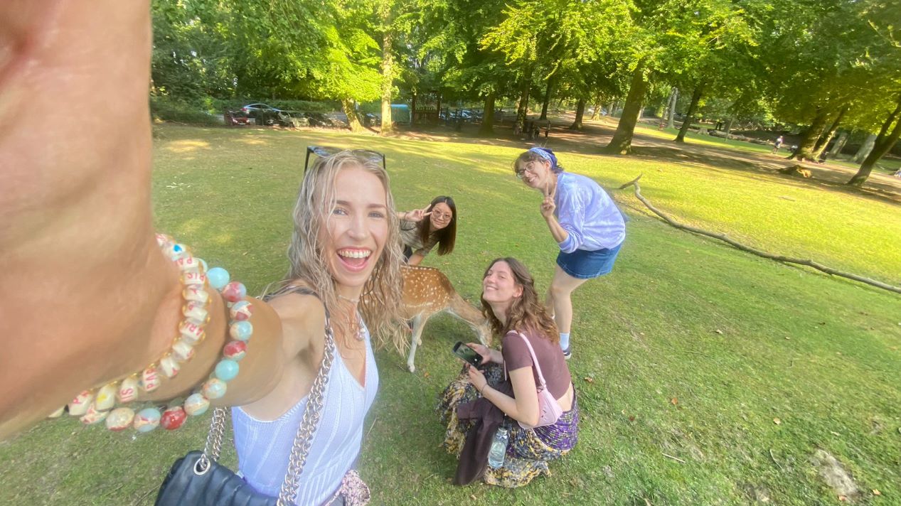 Student and friends in field