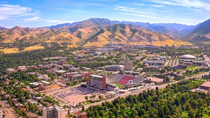Aerial shot of the university with mountains in the background