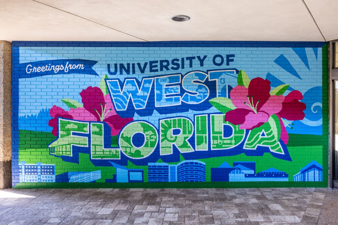 Brightly-coloured Mural that reads: 