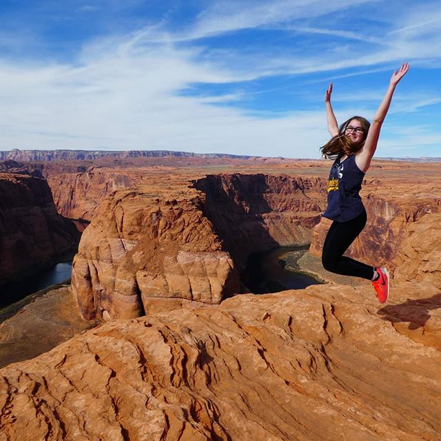 Student jumping in the air at the Grand Canyon