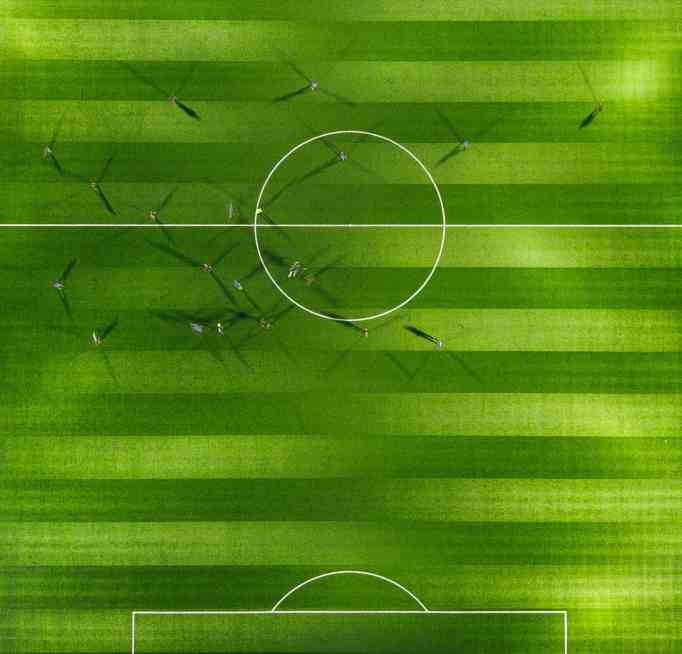 Image of football match in play, taken from a birds-eye view