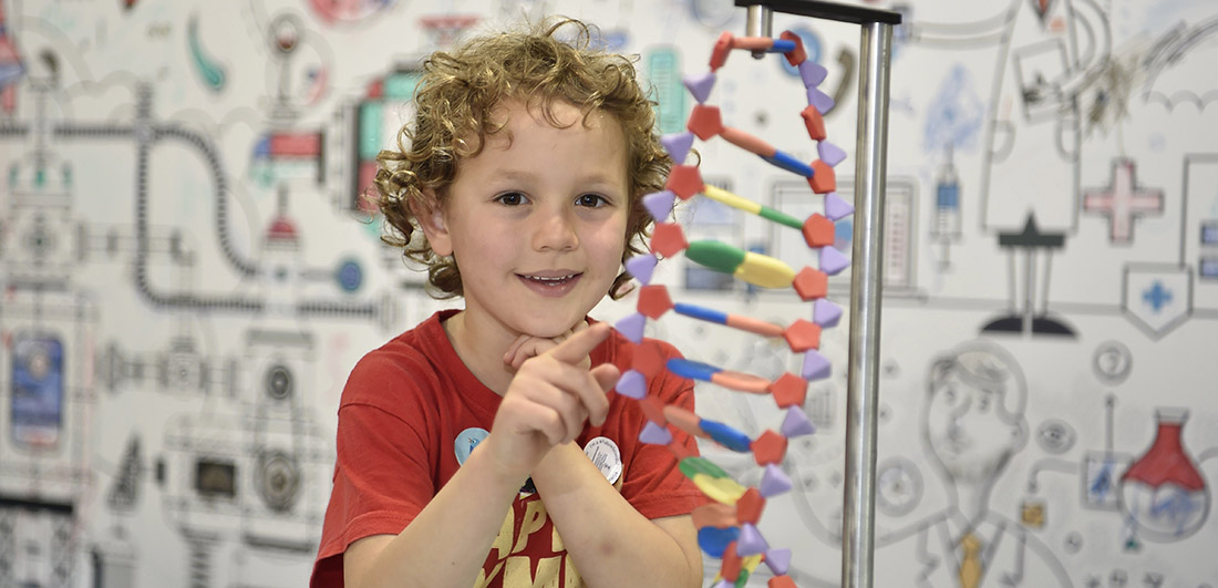 A boy with a molecular structure at the GwyddonLe