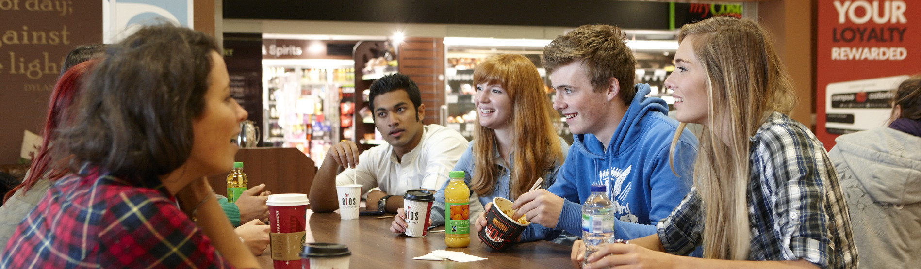 Students chatting in Café Blas over coffee