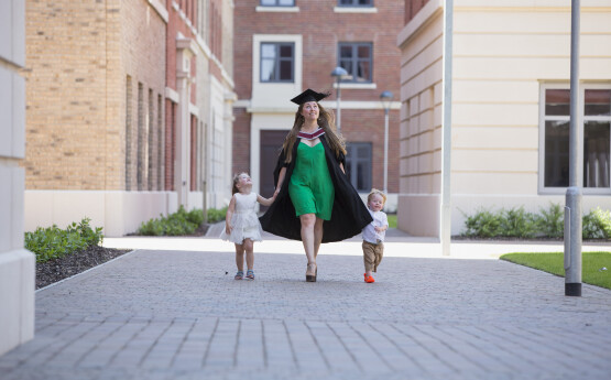 Woman at Graduation with her two children