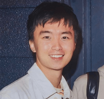 A portrait of Dongkai, our Chinese visiting student, smiling at the camera