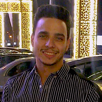 Male Egyptian student smiling at the camera.