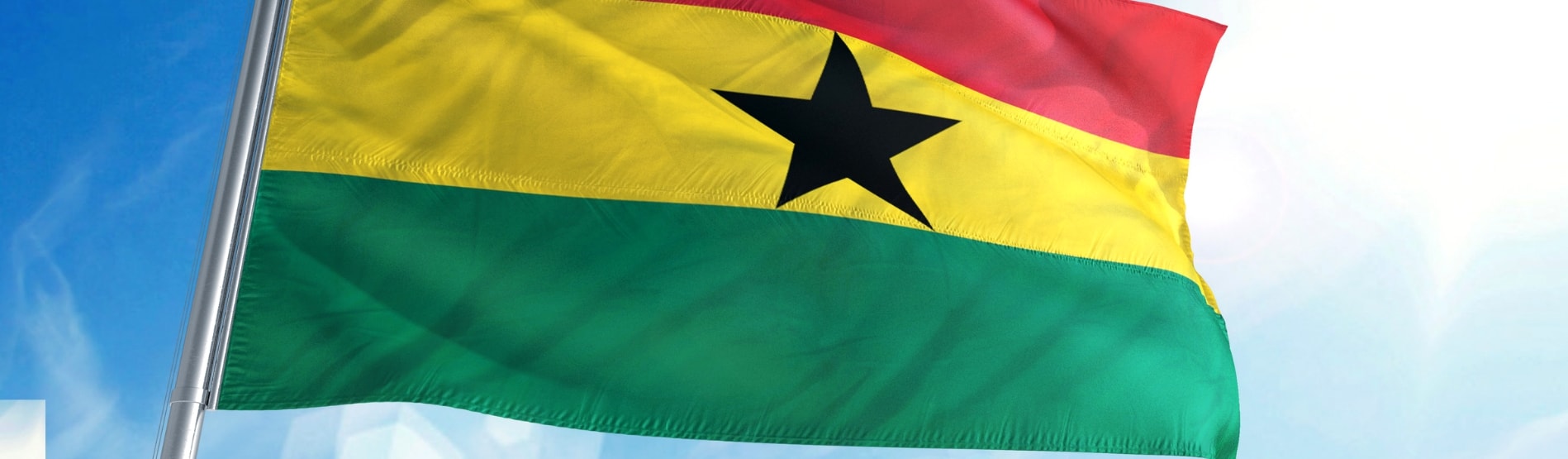 Ghanaian flag blowing in the breeze.