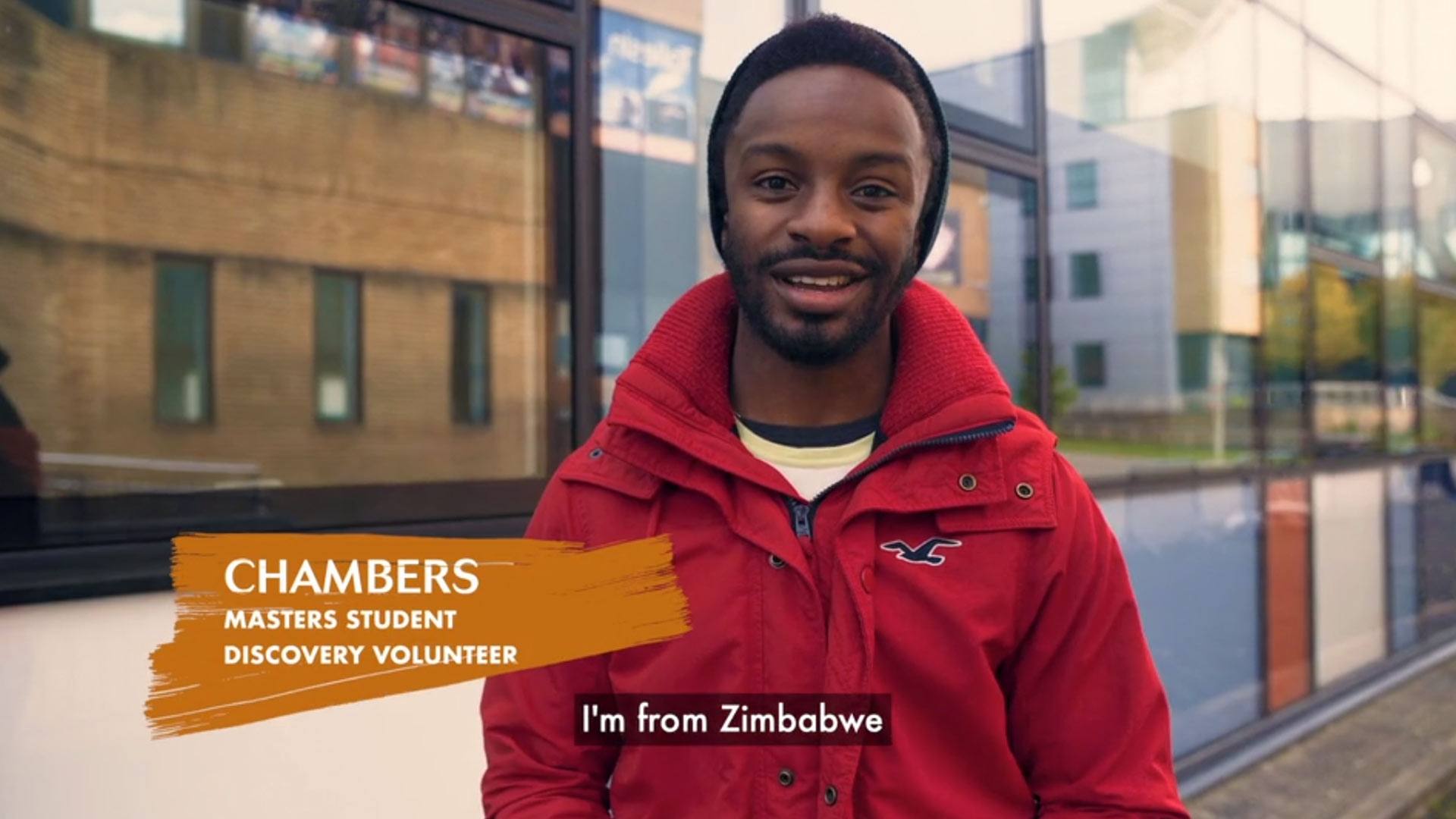 Zimbabwean student standing outside university buildings