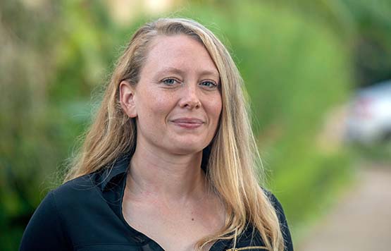 Student smiling at camera