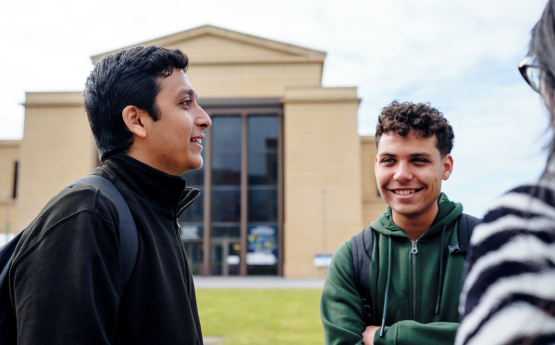 students chatting on Bay Campus