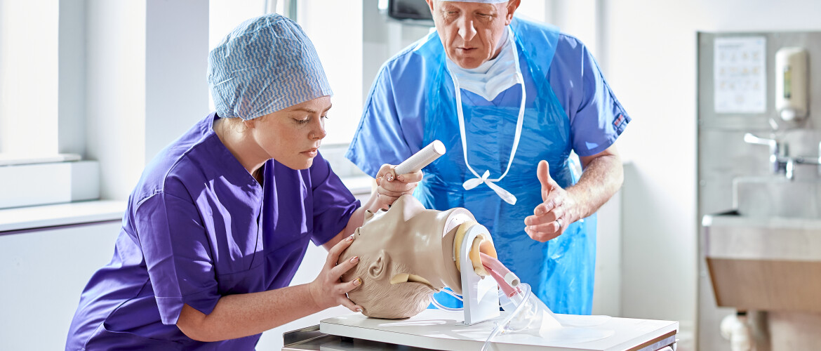 Practical image, student putting tubes into body.