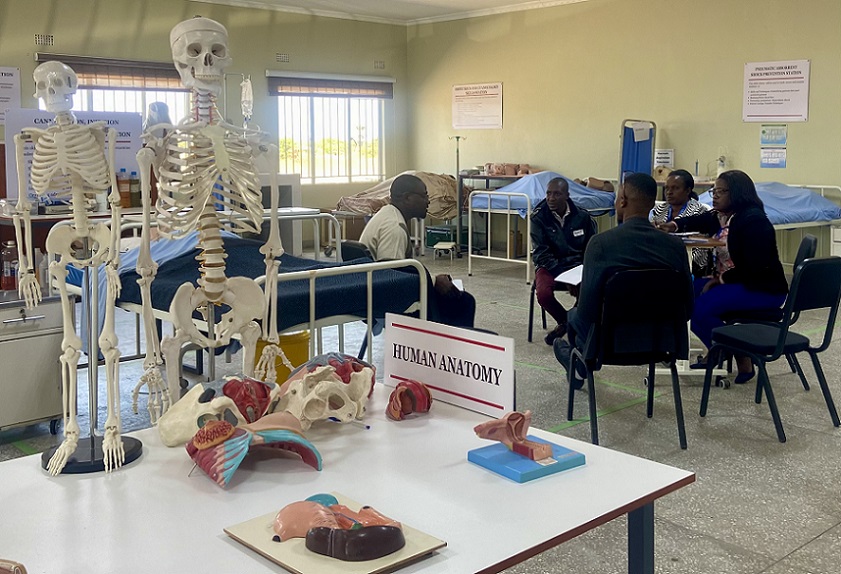 Students sitting in a circle in an anatomy lab