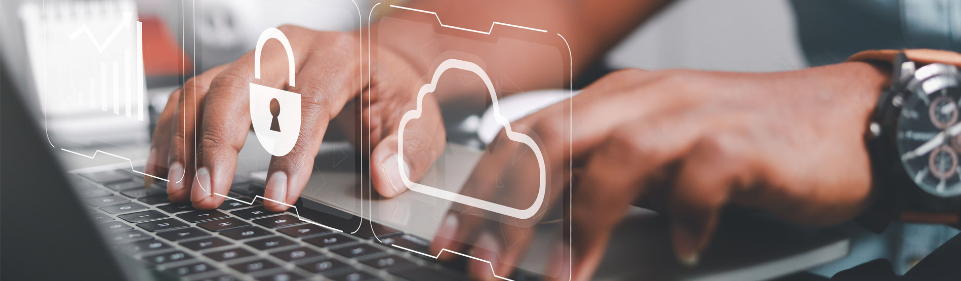 Two hands typing on a laptop