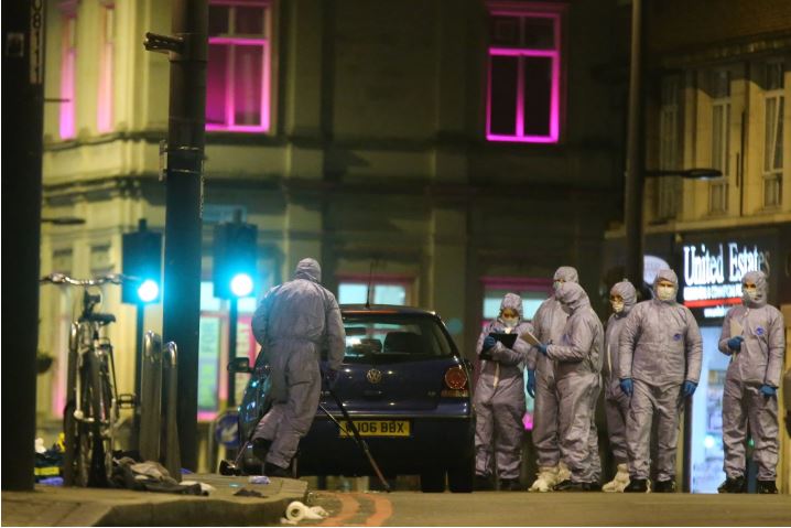 Police forensic officers in South London on Sunday, after a man was shot and killed in what the police called a “terrorist-related” incident