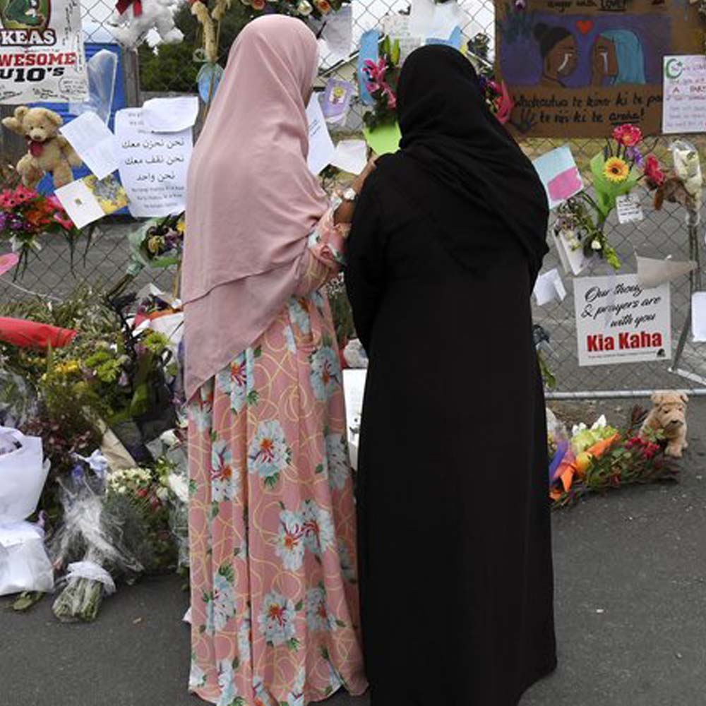 women leaving tributes at the Linwood Islamic Centre in Christchurch