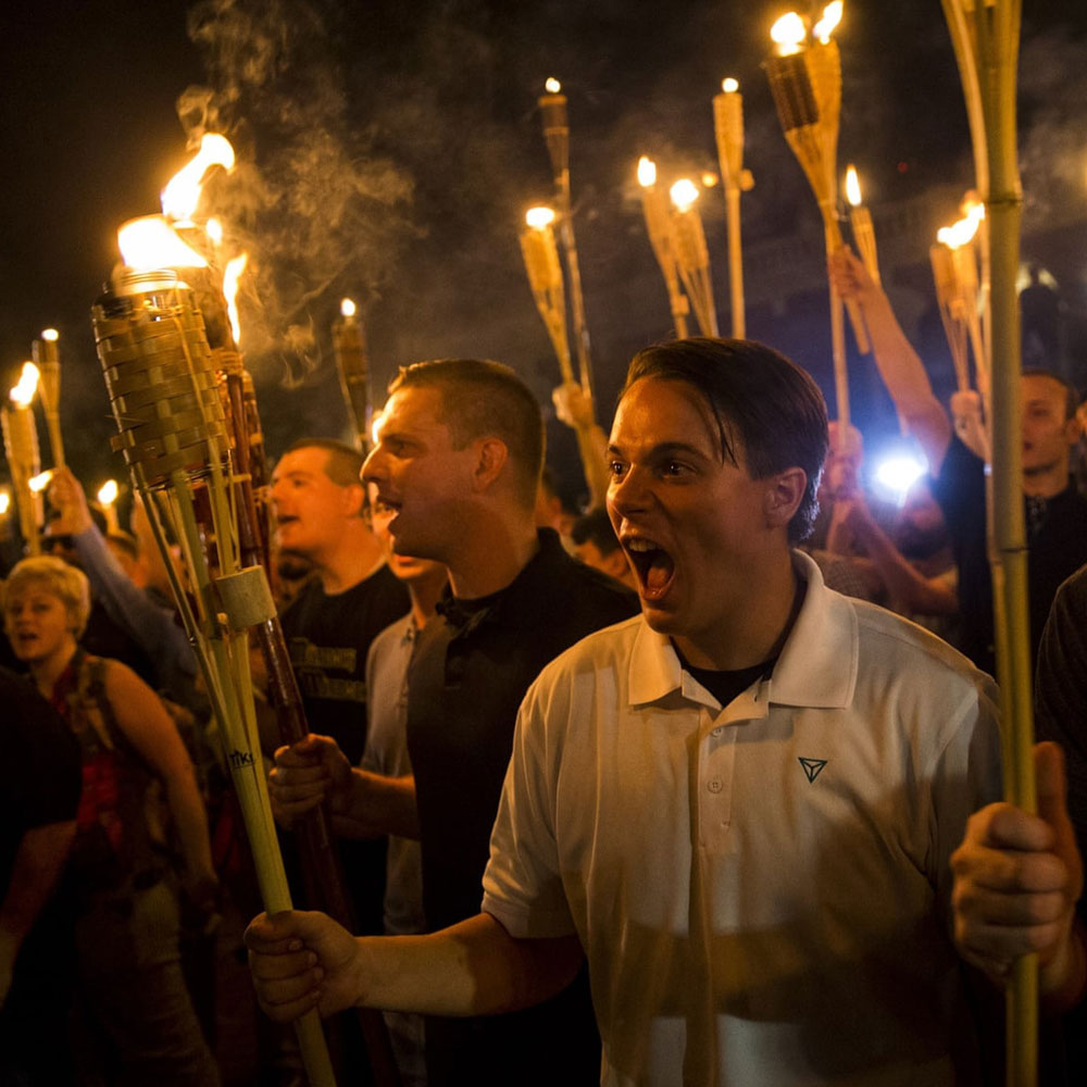 White nationalists chant after marching through the University of Virginia campus with torches in Charlottesville on 11 August 2017
