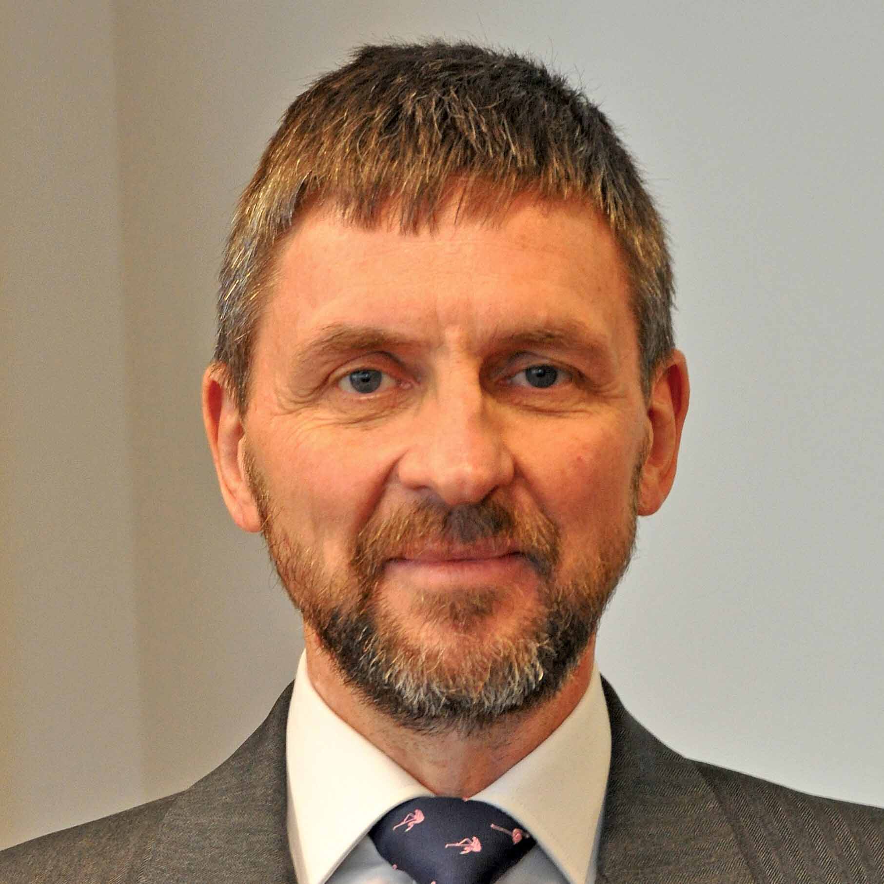 A head shot of Justice Andrew Baker