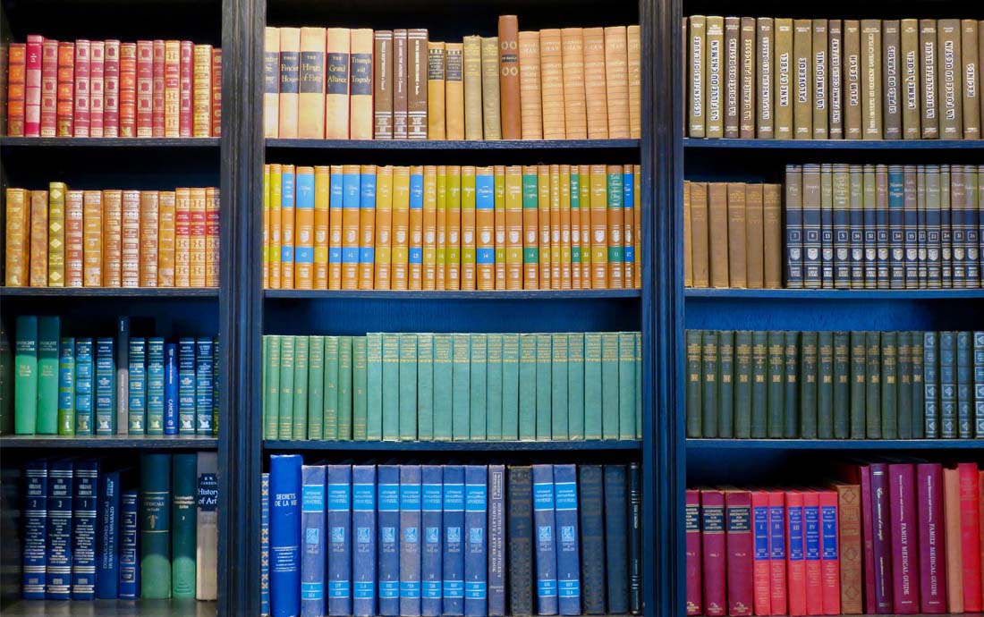 A set of brightly coloured books in a library