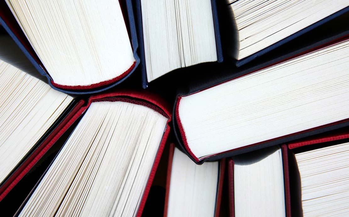 a collection of books photographed from above