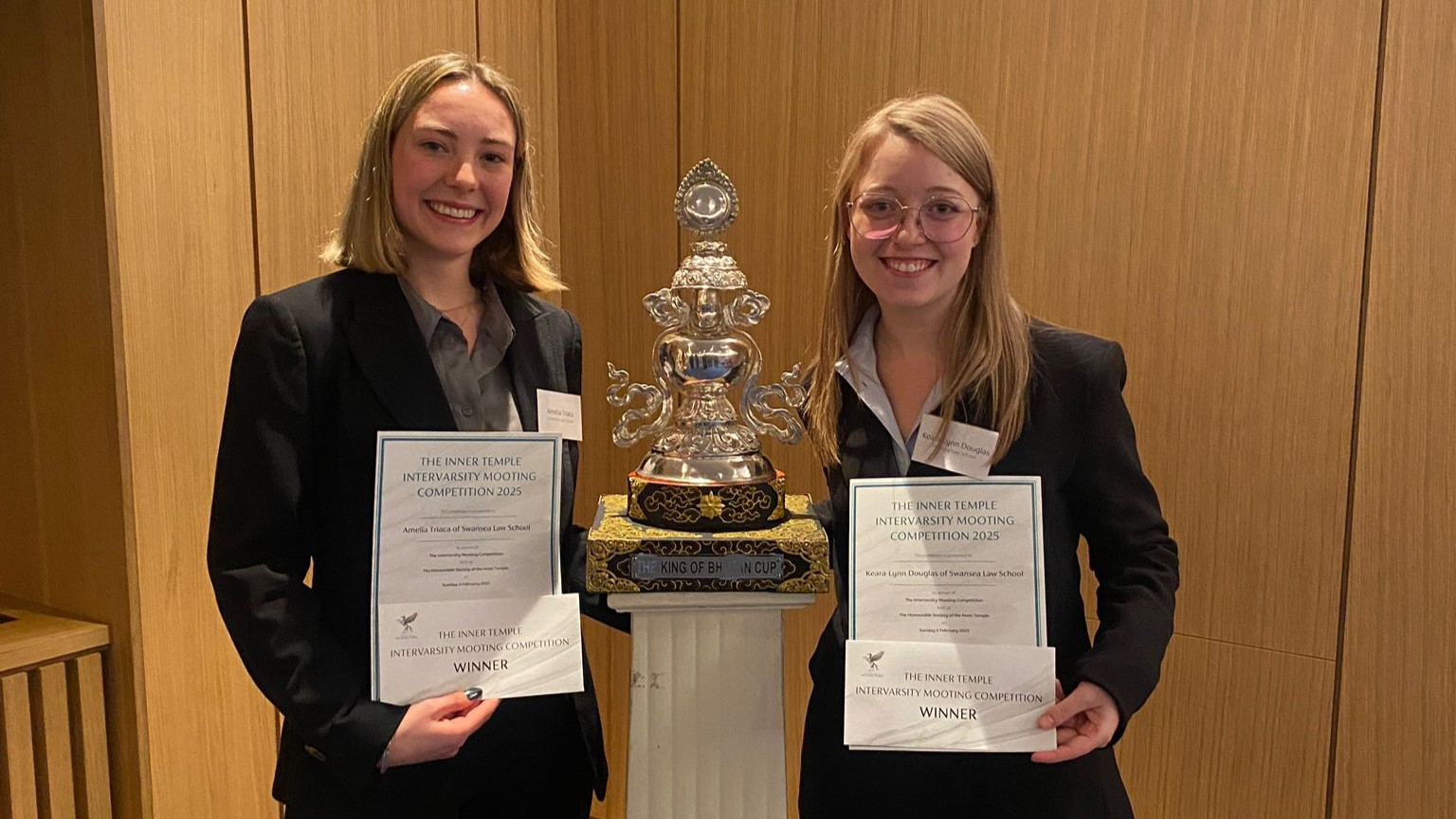 .Award winners with trophy