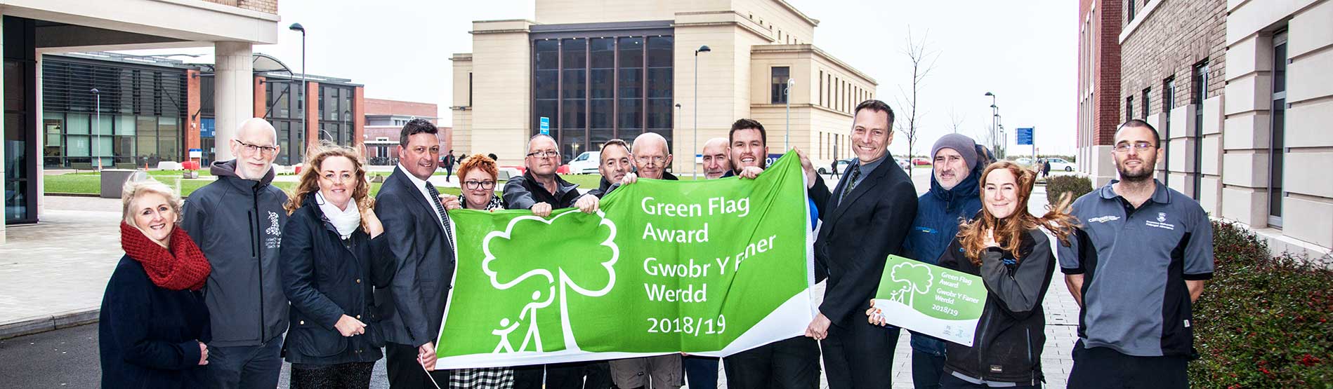 Grounds Team receiving the Green Flag at the Bay Campus