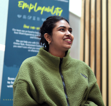 An image of a student smiling.