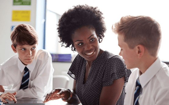A teacher teaching students in a classroom.