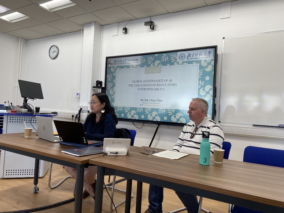 People at the Global Governance of AI talk