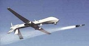 A Predator drone launching a hellfire missile. 