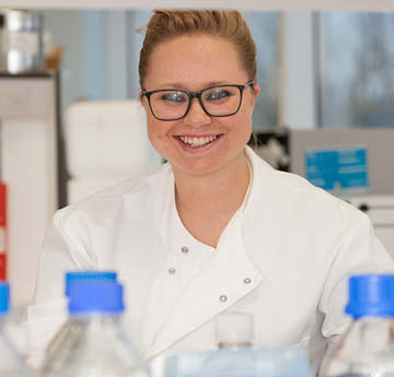 Researcher wearing a white coat in the laboratory