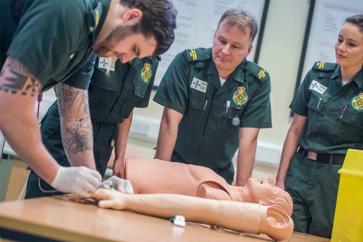 Swansea Uni Paramedic students practising on dummy 