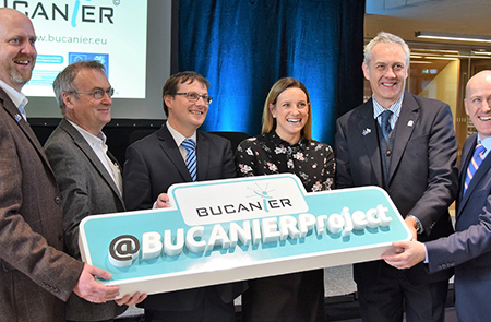 Project Members holding BUCANIER sign