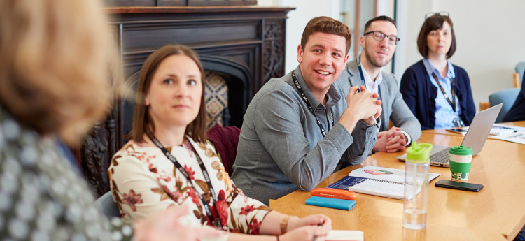 group of staff listening to presentation
