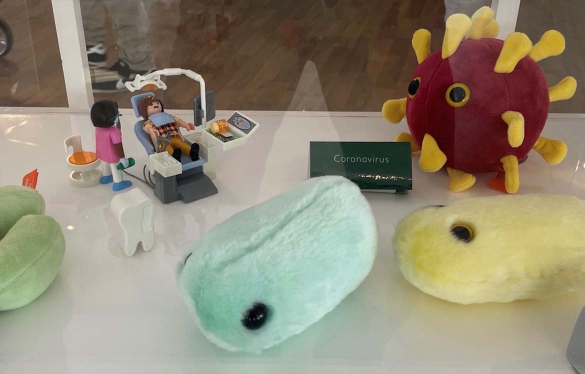 Virus plush teddies and playmobile dentist set mocks up a dentists practice contaminated with live viruses