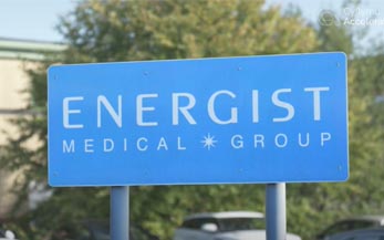 Energist Medical white logo on blue sign