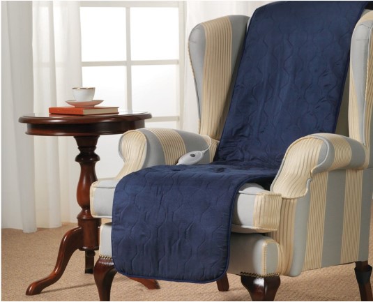 blue heated seat warmer draped over arm chair