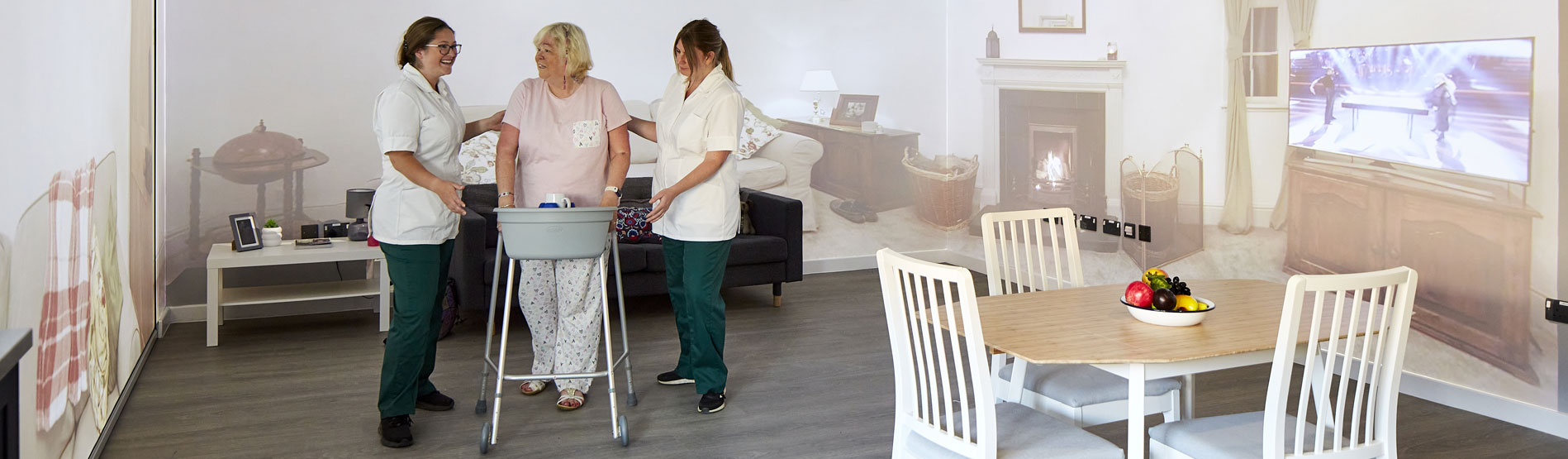 Occupational therapy students with a patient using a walking frame