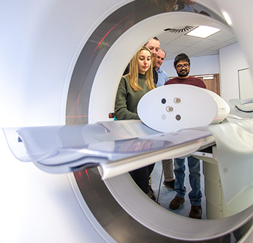 Students learning clinical skills with an MRI 