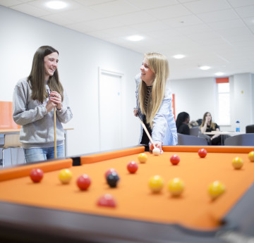 Female students playing pool