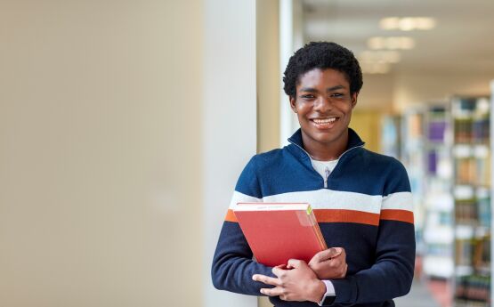 Image of student in Library. 